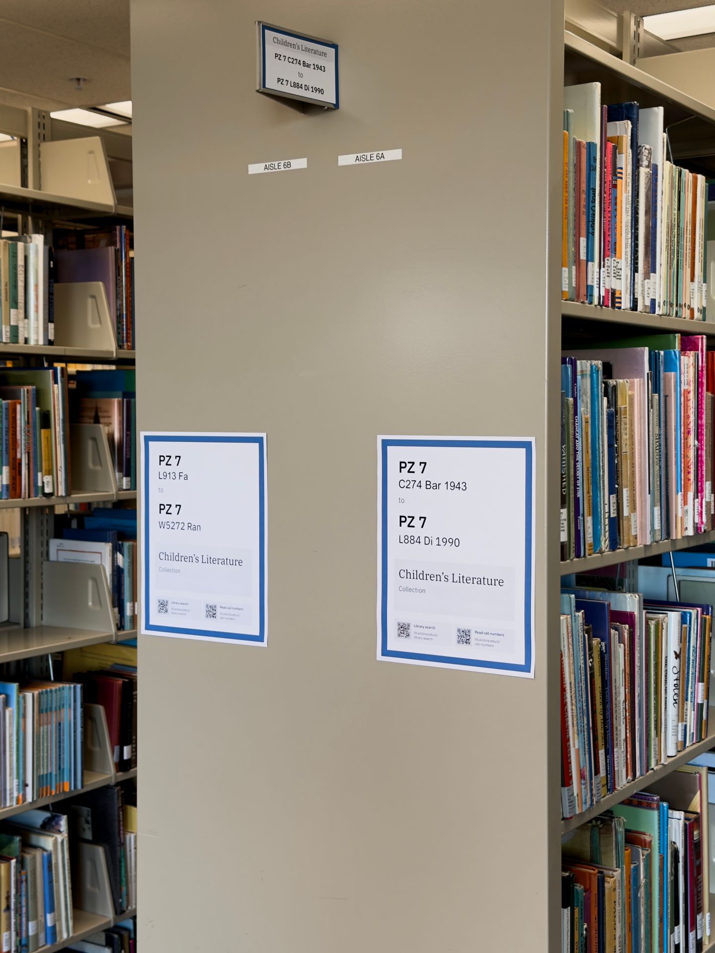 Children's Literature collection stacks with the redesigned signs installed